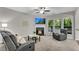 Inviting living room features a cozy fireplace and large windows with natural light at 562 Poplar Bnd, Canton, GA 30114
