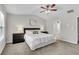 Comfortable main bedroom with large bed, ceiling fan, bedside tables and carpeted floor at 562 Poplar Bnd, Canton, GA 30114