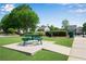 Community picnic area with green metal table and benches at 562 Poplar Bnd, Canton, GA 30114