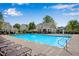 Community pool with lounge chairs and splash fountain, perfect for relaxing on a hot day at 562 Poplar Bnd, Canton, GA 30114