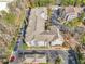 Overhead view of community buildings with ample parking, surrounded by mature trees at 1250 Parkwood Se Cir # 3001, Atlanta, GA 30339