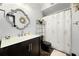 Bathroom with a modern vanity, designer mirror, and a shower with a decorative shower curtain at 1250 Parkwood Se Cir # 3001, Atlanta, GA 30339