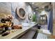 Bathroom with a large vanity, vessel sinks, wood-framed mirrors, and mosaic-tiled walls at 1250 Parkwood Se Cir # 3001, Atlanta, GA 30339