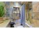 Stylish bathroom featuring a tiled shower with a grey shower curtain at 1250 Parkwood Se Cir # 3001, Atlanta, GA 30339