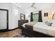 Bedroom featuring a queen-size bed, dark wood furniture and neutral walls illuminated by a modern ceiling fan at 1250 Parkwood Se Cir # 3001, Atlanta, GA 30339