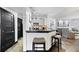 A charming kitchen featuring a breakfast bar, stainless steel appliances, and elegant modern finishes at 1250 Parkwood Se Cir # 3001, Atlanta, GA 30339