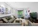 Comfortable living room with modern decor, a plush sofa, and a serene view at 1250 Parkwood Se Cir # 3001, Atlanta, GA 30339