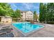 Refreshing community pool with lounge chairs and shaded areas, ideal for relaxation and recreation at 1250 Parkwood Se Cir # 3001, Atlanta, GA 30339
