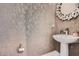 Powder bathroom with stylish walls, vessel sink and artistic circular mirror at 2543 Oakbourne Ln # 14, Smyrna, GA 30080