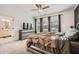 Comfortable main bedroom with three large windows and a peek into the bathroom at 2543 Oakbourne Ln # 14, Smyrna, GA 30080