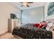 Comfortable bedroom featuring a ceiling fan, dresser with TV, and a cozy bed at 2543 Oakbourne Ln # 14, Smyrna, GA 30080
