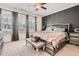 Comfortable bedroom with gray walls, three large windows and a leather bench at 2543 Oakbourne Ln # 14, Smyrna, GA 30080