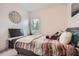 Neutral bedroom with accent mirror, plush bedding and natural light at 2543 Oakbourne Ln # 14, Smyrna, GA 30080