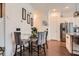 Cozy dining area with a glass-top table, elegant chairs, and modern lighting fixtures at 2543 Oakbourne Ln # 14, Smyrna, GA 30080