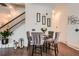 Stylish dining area with chic chairs, hardwood floors, and modern artwork, creating an inviting space at 2543 Oakbourne Ln # 14, Smyrna, GA 30080