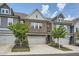 Attractive townhome showcasing a brick exterior, well-maintained landscaping, and a convenient two-car garage at 2543 Oakbourne Ln # 14, Smyrna, GA 30080