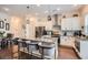 Bright kitchen featuring white cabinets, stainless steel appliances and a large granite island with seating at 2543 Oakbourne Ln # 14, Smyrna, GA 30080