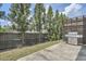 Grilling area in backyard with a stainless steel grill and tall trees at 2543 Oakbourne Ln # 14, Smyrna, GA 30080