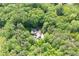 Secluded property featuring a home nestled among lush, mature trees, offering privacy at 465 Willowbrook Se Dr, Smyrna, GA 30082