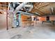 Unfinished basement area with workbench and exposed ductwork at 465 Willowbrook Se Dr, Smyrna, GA 30082