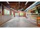 Spacious unfinished basement with windows, workbench, and exposed ceiling at 465 Willowbrook Se Dr, Smyrna, GA 30082