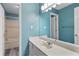 Stylish bathroom with a large mirror, modern vanity, and a shower-tub combo at 465 Willowbrook Se Dr, Smyrna, GA 30082