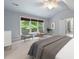 Bright bedroom with large windows, seating area, and vaulted ceilings at 465 Willowbrook Se Dr, Smyrna, GA 30082