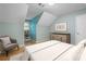 Bedroom featuring light teal walls, wood floors and modern decor at 465 Willowbrook Se Dr, Smyrna, GA 30082