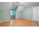 Charming bedroom with sloped ceilings, hardwood floors, and large windows at 465 Willowbrook Se Dr, Smyrna, GA 30082