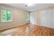 Bright bedroom with hardwood floors, and natural light from the two large windows at 465 Willowbrook Se Dr, Smyrna, GA 30082