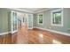 Bright bedroom featuring hardwood floors, a large window, and fresh paint at 465 Willowbrook Se Dr, Smyrna, GA 30082