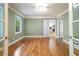 Bright bedroom featuring hardwood floors, a large window, and fresh paint at 465 Willowbrook Se Dr, Smyrna, GA 30082