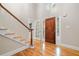Grand foyer featuring hardwood floors, staircase and natural light at 465 Willowbrook Se Dr, Smyrna, GA 30082