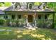 Inviting front porch with a charming wood railing and a welcoming entrance at 465 Willowbrook Se Dr, Smyrna, GA 30082
