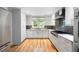 Modern kitchen featuring white cabinets, stainless steel appliances, and granite countertops at 465 Willowbrook Se Dr, Smyrna, GA 30082