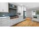 Modern kitchen featuring white cabinets, stainless steel appliances, and granite countertops at 465 Willowbrook Se Dr, Smyrna, GA 30082