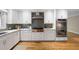 Modern kitchen featuring stainless steel appliances and stylish white cabinetry at 465 Willowbrook Se Dr, Smyrna, GA 30082