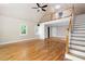 Open living room shows the hardwood floors, staircase and loft area at 465 Willowbrook Se Dr, Smyrna, GA 30082