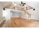 Sunlit living room boasts hardwood floors, a staircase, and open floor plan at 465 Willowbrook Se Dr, Smyrna, GA 30082