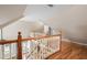 Open loft area with hardwood floors overlooks the living room at 465 Willowbrook Se Dr, Smyrna, GA 30082