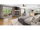Elegant main bedroom featuring a stone fireplace and a private patio at 465 Willowbrook Se Dr, Smyrna, GA 30082