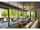 Screened in patio with comfortable outdoor seating overlooking lush greenery at 465 Willowbrook Se Dr, Smyrna, GA 30082