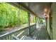 Relaxing porch showcasing serene views of a lush green yard and surrounding trees at 465 Willowbrook Se Dr, Smyrna, GA 30082