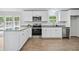 Updated kitchen featuring granite countertops, stainless steel appliances, and plenty of cabinet space at 6670 George Ct, Cumming, GA 30041