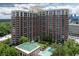 Tall condo building with a lovely manicured lawn and pool area at 1820 Peachtree St # 614, Atlanta, GA 30309