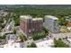 Aerial view showcasing modern apartment buildings with surrounding lush greenery and convenient parking at 1820 Peachtree St # 614, Atlanta, GA 30309
