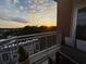 Enjoy the view from this private balcony overlooking a sunset and neighborhood trees at 1820 Peachtree St # 614, Atlanta, GA 30309