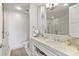 Modern bathroom boasts double sinks with marble countertops, a walk-in shower, and updated fixtures at 1820 Peachtree St # 614, Atlanta, GA 30309
