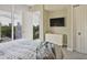 Comfortable bedroom features large windows offering city views, with a dresser and ample closet space at 1820 Peachtree St # 614, Atlanta, GA 30309