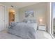 Comfortable bedroom features a queen-size bed, ocean-themed artwork, and an ensuite bathroom at 1820 Peachtree St # 614, Atlanta, GA 30309